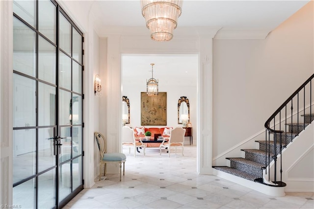 interior space with crown molding and a notable chandelier