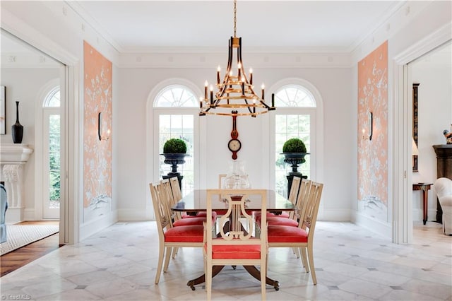 dining room featuring ornamental molding, a chandelier, and plenty of natural light