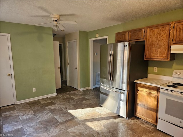 kitchen featuring white range with electric stovetop, ceiling fan, a textured ceiling, and stainless steel refrigerator