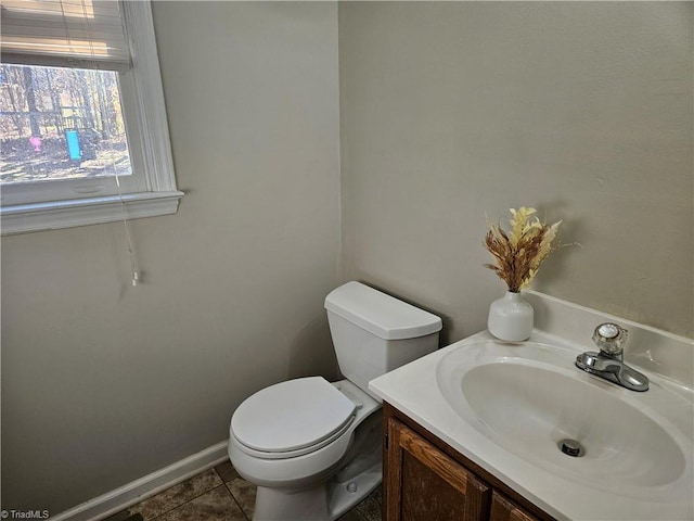 bathroom featuring tile patterned floors, vanity, and toilet