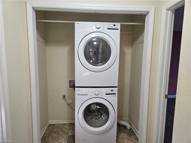 laundry room with stacked washer and dryer