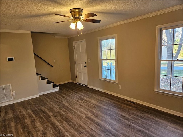 foyer with ceiling fan, dark hardwood / wood-style flooring, crown molding, and a textured ceiling