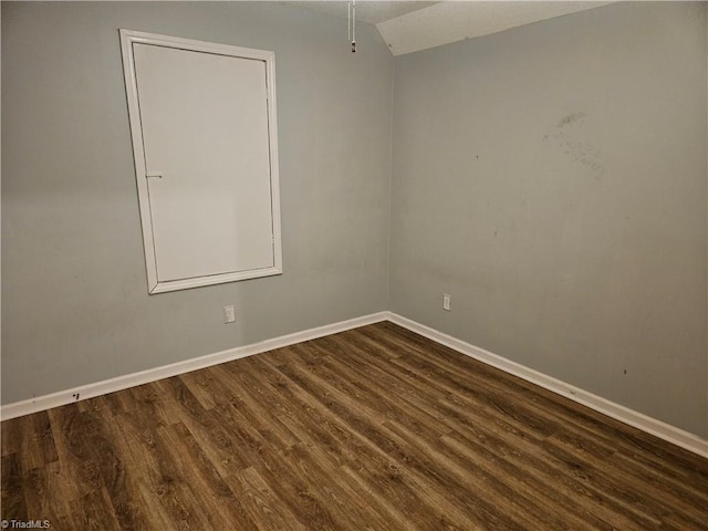 spare room featuring dark hardwood / wood-style floors