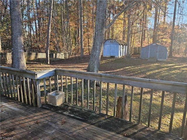 wooden deck featuring a shed