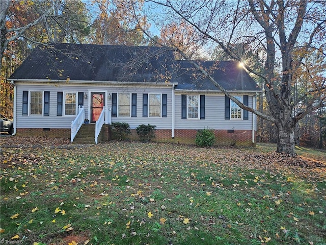 ranch-style home featuring a front yard