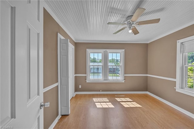 307 S Key St, Pilot Mountain, NC 27041 - spare room with light wood finished floors, ceiling fan, baseboards, and ornamental molding