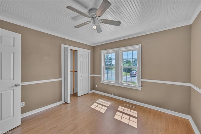 307 S Key St, Pilot Mountain, NC 27041 - unfurnished bedroom with baseboards, wood finished floors, ceiling fan, a closet, and crown molding