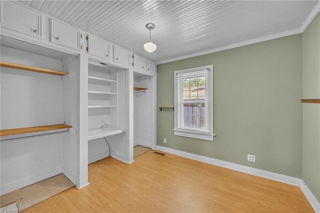 307 S Key St, Pilot Mountain, NC 27041 - unfurnished bedroom featuring baseboards, ornamental molding, and light wood-style flooring