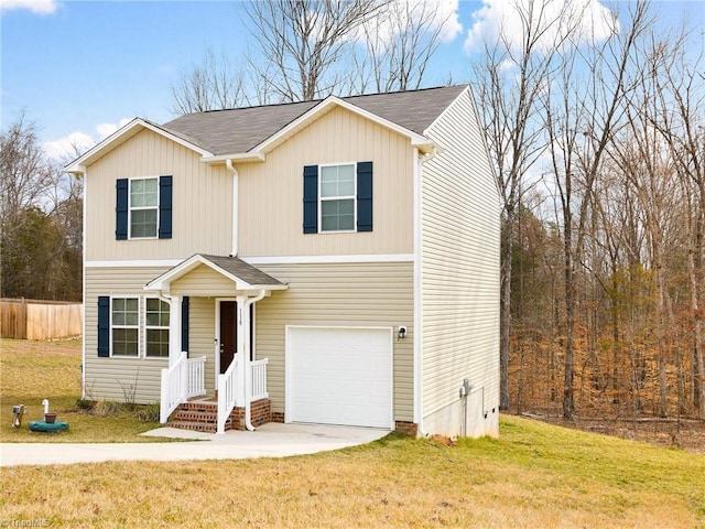 traditional-style home with a front yard, concrete driveway, fence, and an attached garage