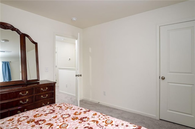 unfurnished bedroom with carpet flooring and baseboards