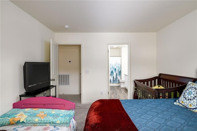 carpeted bedroom with visible vents