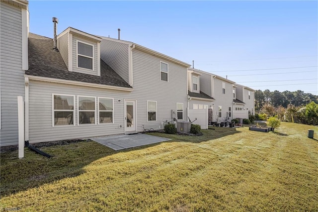 rear view of property featuring a patio and a yard