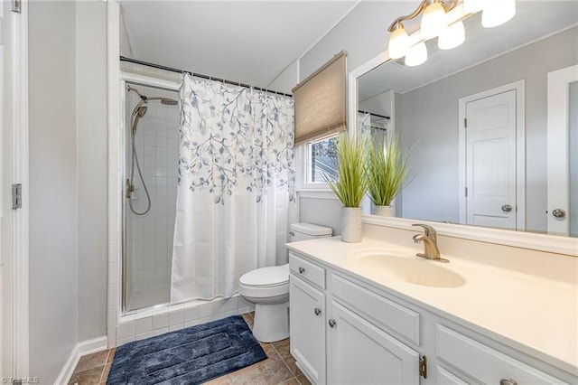 full bath with vanity, toilet, and a tile shower