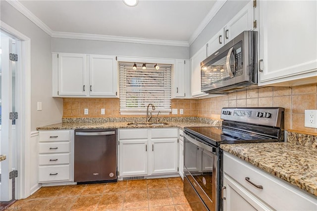 kitchen featuring a sink, stainless steel appliances, ornamental molding, and white cabinetry