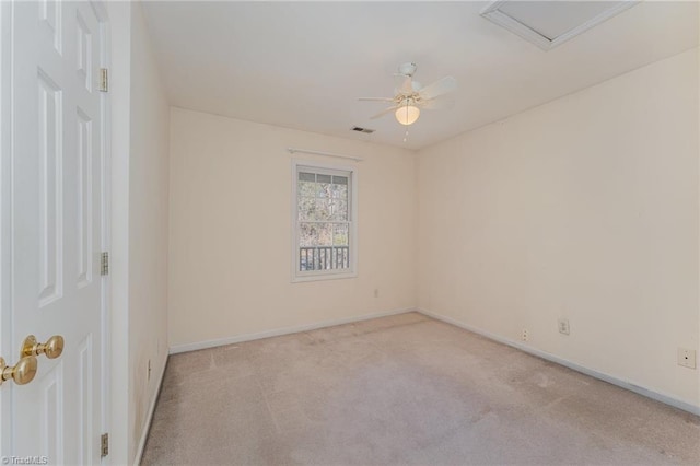 empty room featuring light colored carpet and ceiling fan