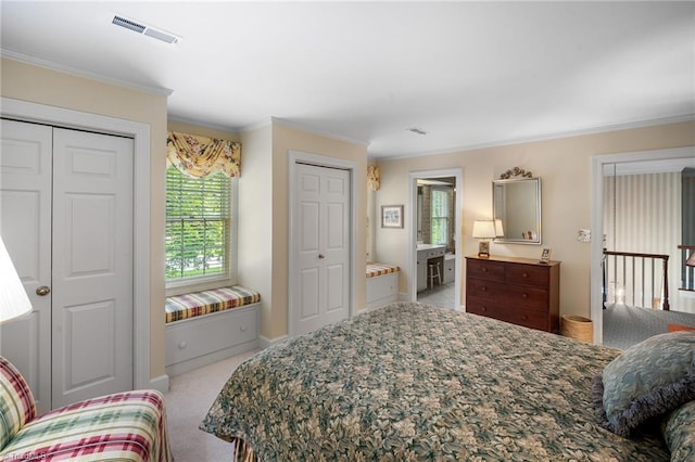 bedroom with crown molding and light colored carpet