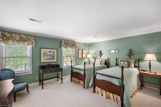 carpeted bedroom with crown molding