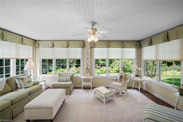 sunroom with ceiling fan and a healthy amount of sunlight