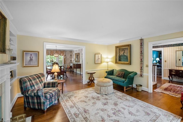 living room featuring dark hardwood / wood-style floors and crown molding