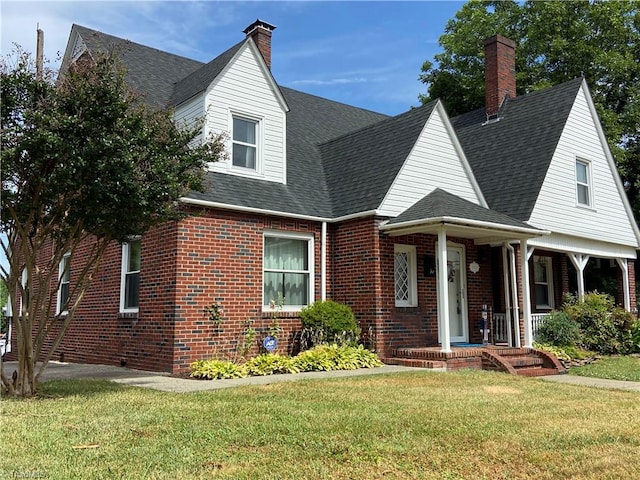 view of front of house featuring a front yard and covered porch