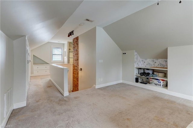 bonus room with baseboards, visible vents, carpet floors, and lofted ceiling