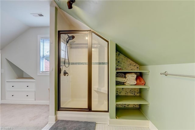 full bath with lofted ceiling, baseboards, visible vents, and a stall shower