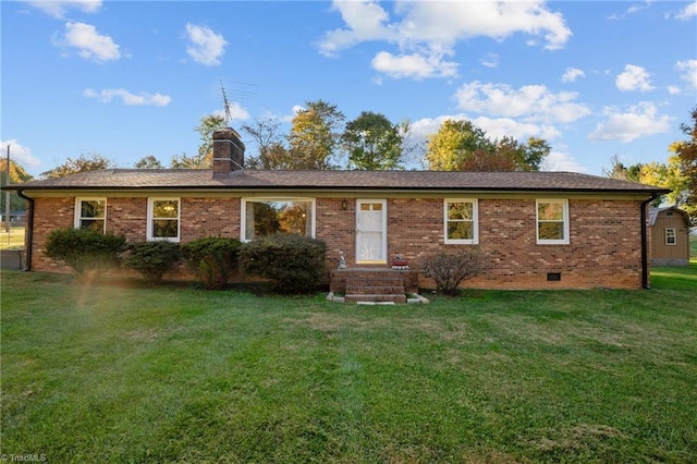 back of house with a lawn