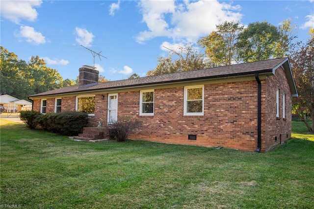 back of house featuring a yard