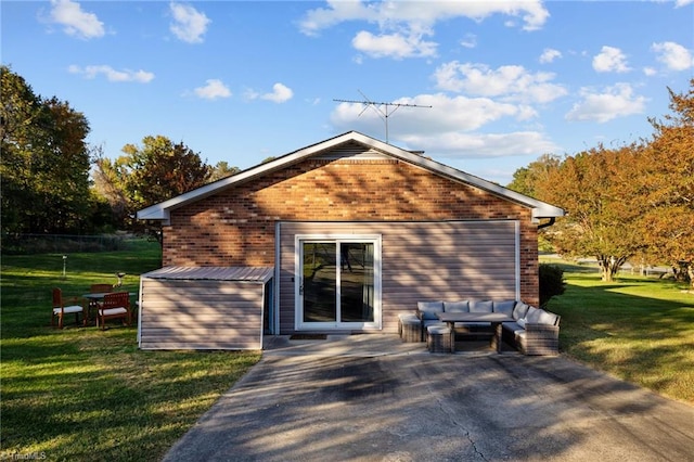 rear view of house featuring a lawn