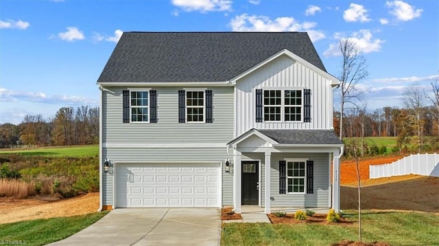 front facade featuring a front lawn and a garage