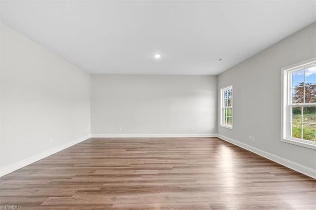 spare room featuring light wood-type flooring