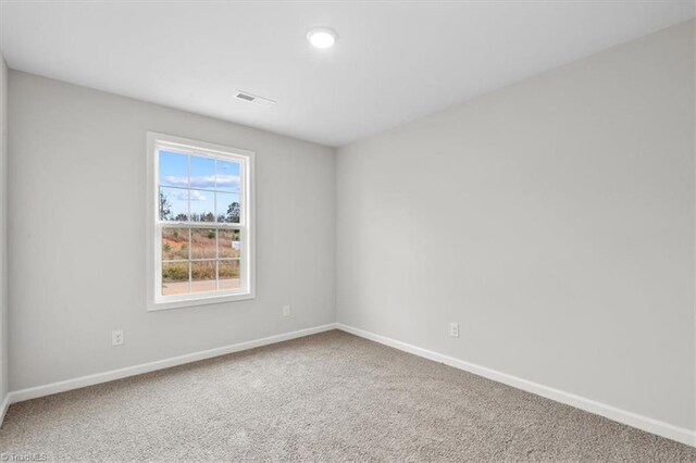 empty room with carpet flooring