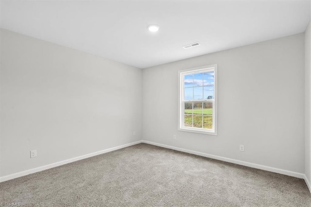 unfurnished room featuring carpet flooring