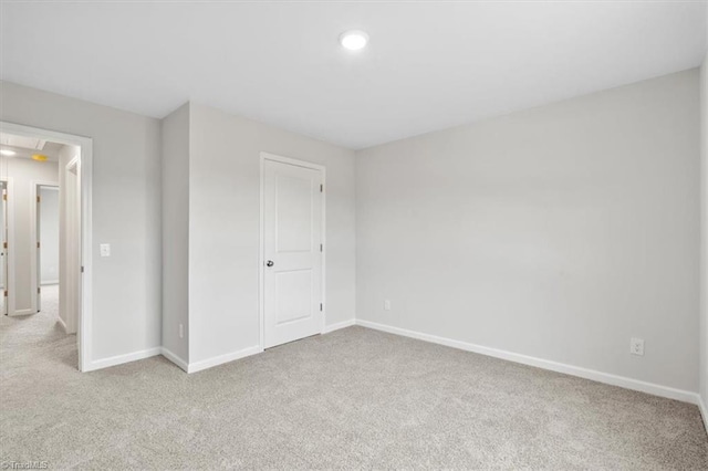 unfurnished bedroom with light colored carpet