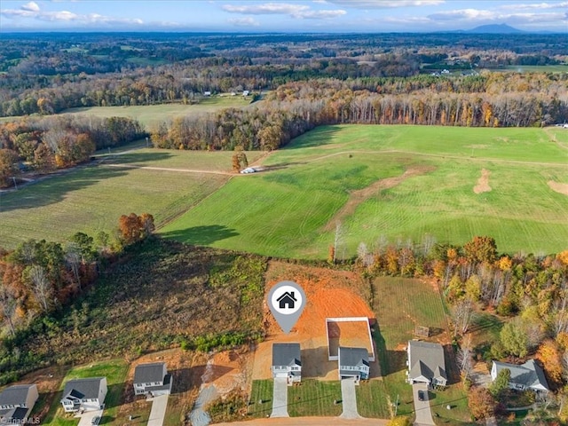 birds eye view of property with a rural view