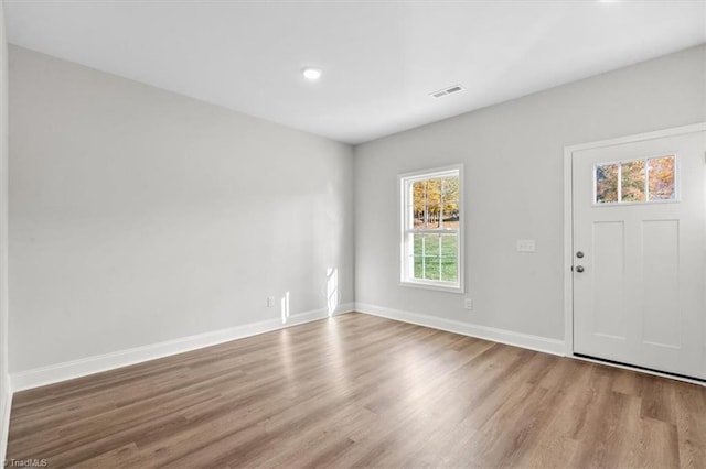 foyer entrance with light hardwood / wood-style flooring