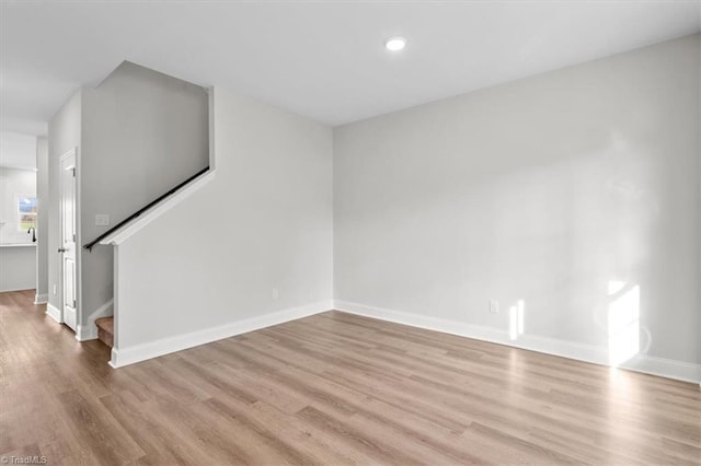 unfurnished living room featuring light hardwood / wood-style floors