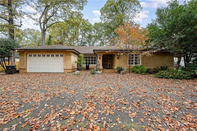 ranch-style house featuring a garage