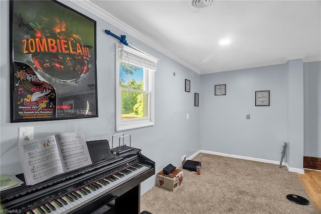 sitting room featuring ornamental molding, baseboards, and carpet floors