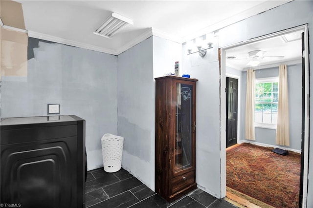 bathroom featuring ornamental molding and ceiling fan