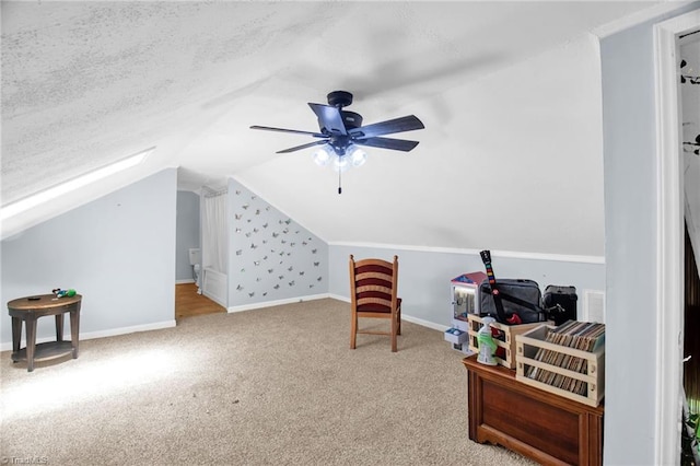 additional living space with lofted ceiling, carpet floors, ceiling fan, and baseboards