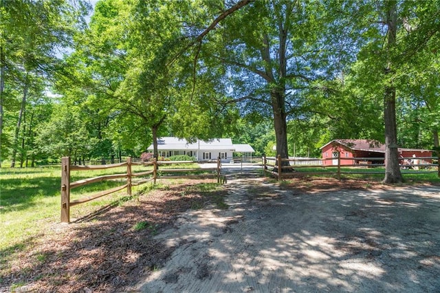 view of front of home featuring fence