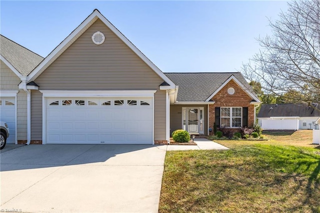 ranch-style home featuring a front lawn and a garage