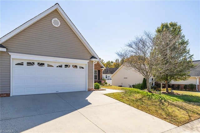 view of front of property with a front yard and a garage