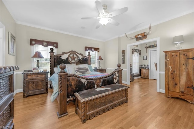 bedroom with ceiling fan, light wood-type flooring, and crown molding