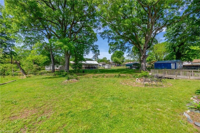 view of yard with a fire pit