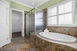 bathroom with ornamental molding and plus walk in shower