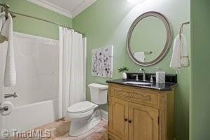 full bathroom featuring shower / tub combo, vanity, crown molding, and toilet