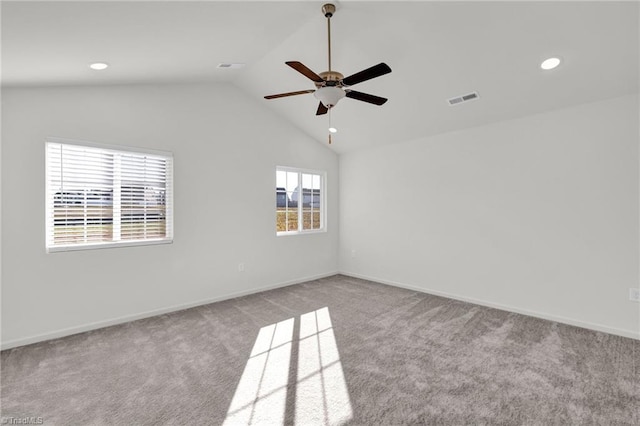 carpeted spare room with lofted ceiling, visible vents, baseboards, and recessed lighting