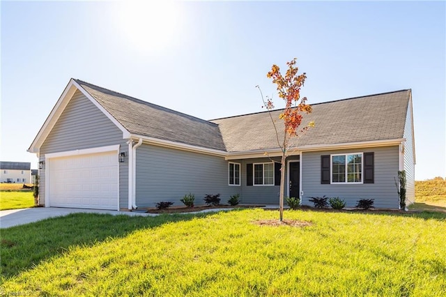 ranch-style house featuring a garage, driveway, and a front yard